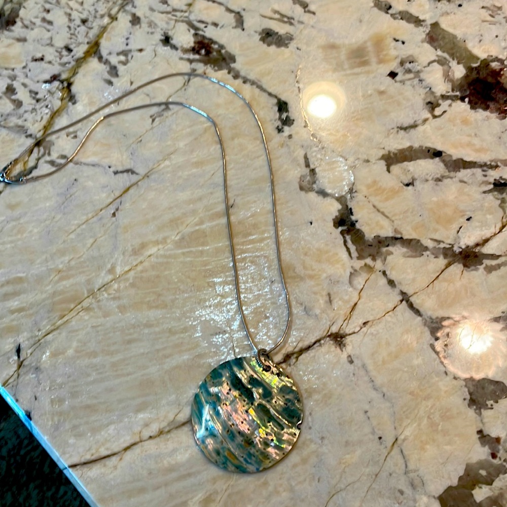 Italian made silver chain with shell charm.